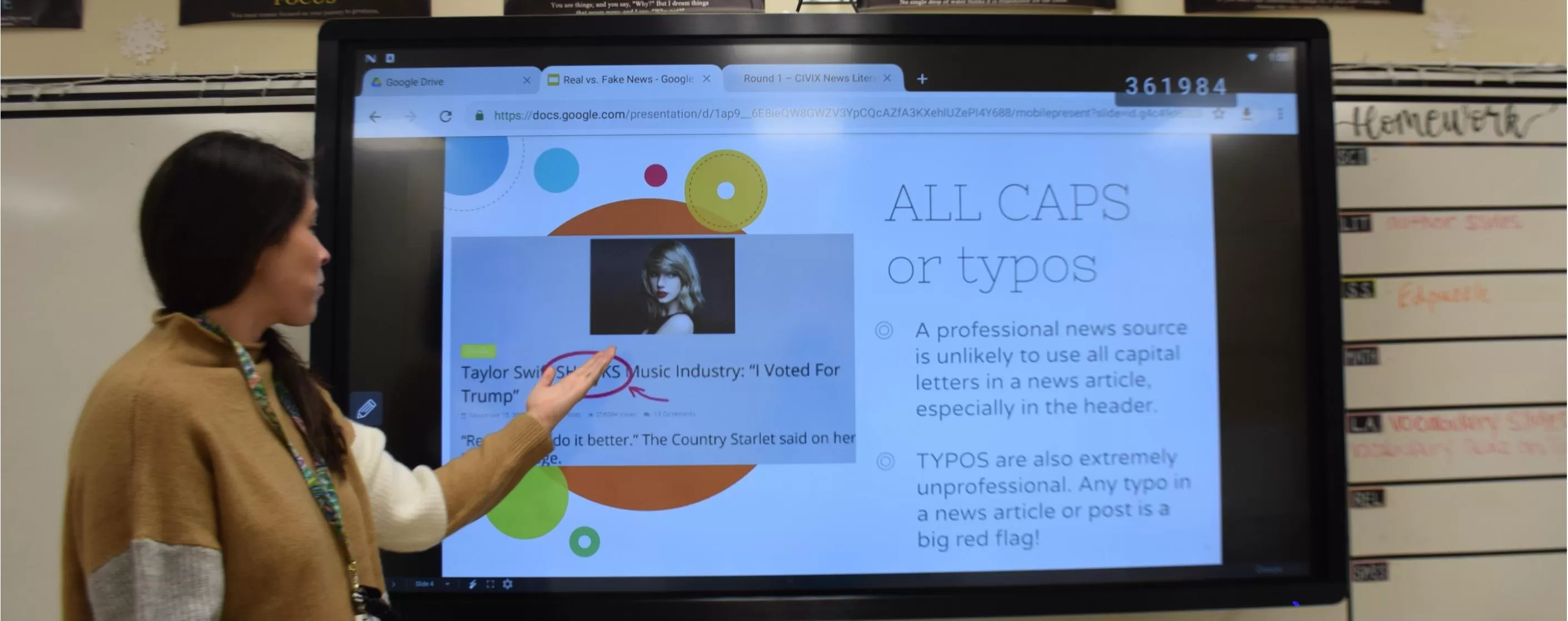 a teacher using a IMPACT Plus in a classroom to access their Gdrive