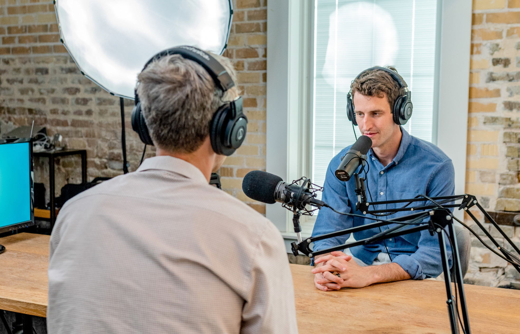 people recording a podcast (close up)